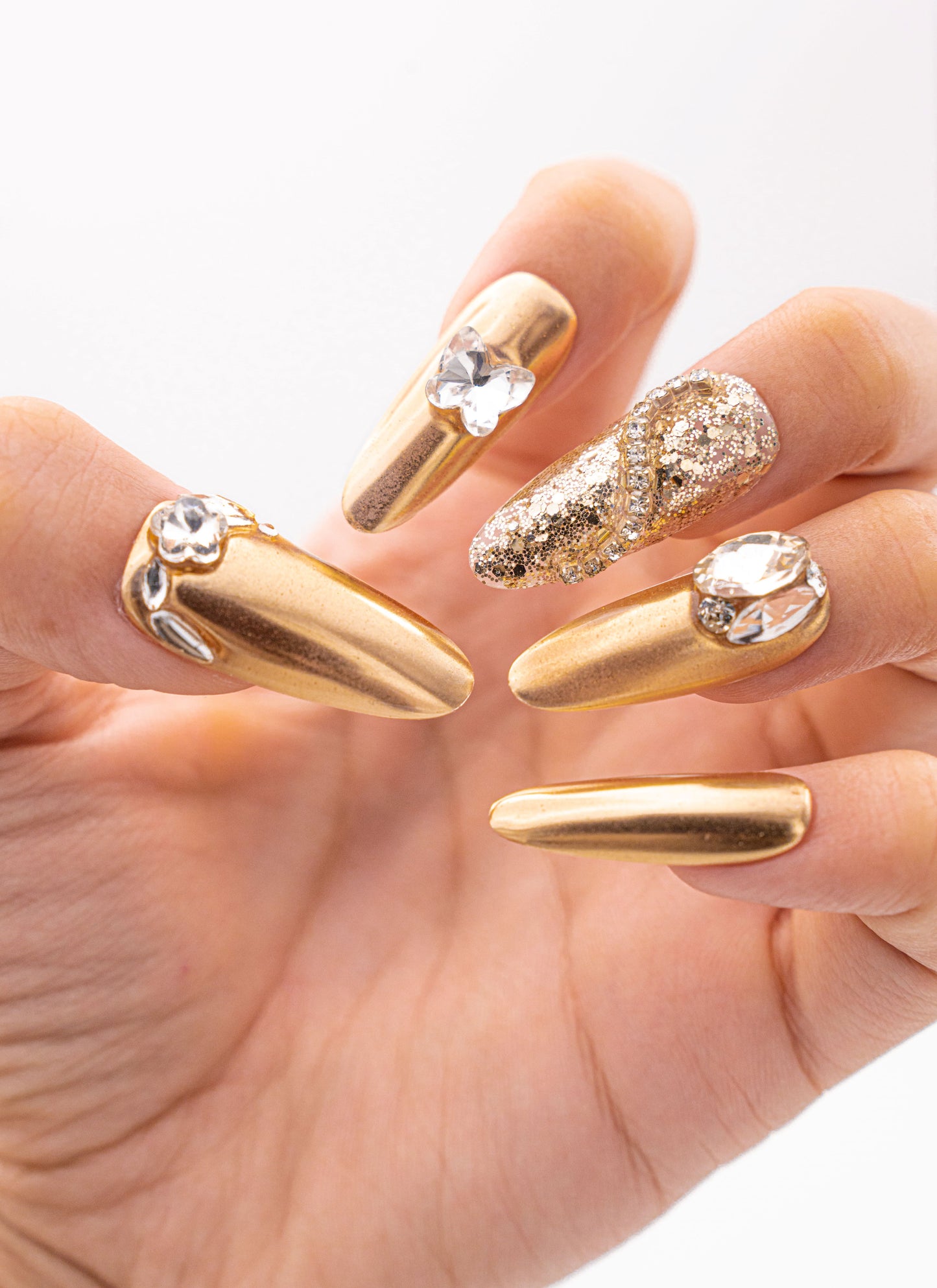 Close up image, Golden Glamour Press-On Nails with Luxe Rhinestone Accents - Effortless Luxury