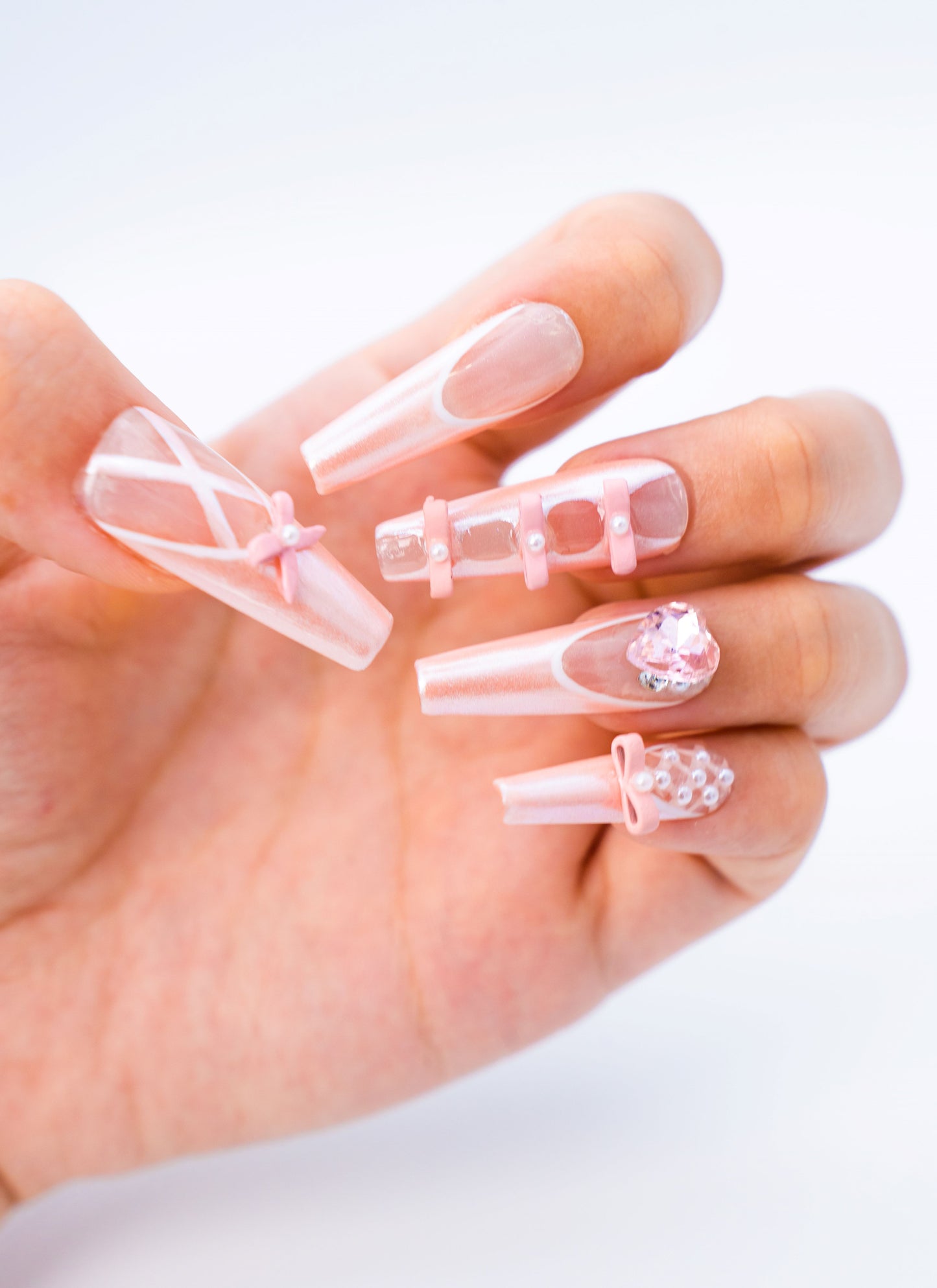 Close up image, Ballet Slipper Pink Press-On Nails: Bow Accents & Heart Rhinestone