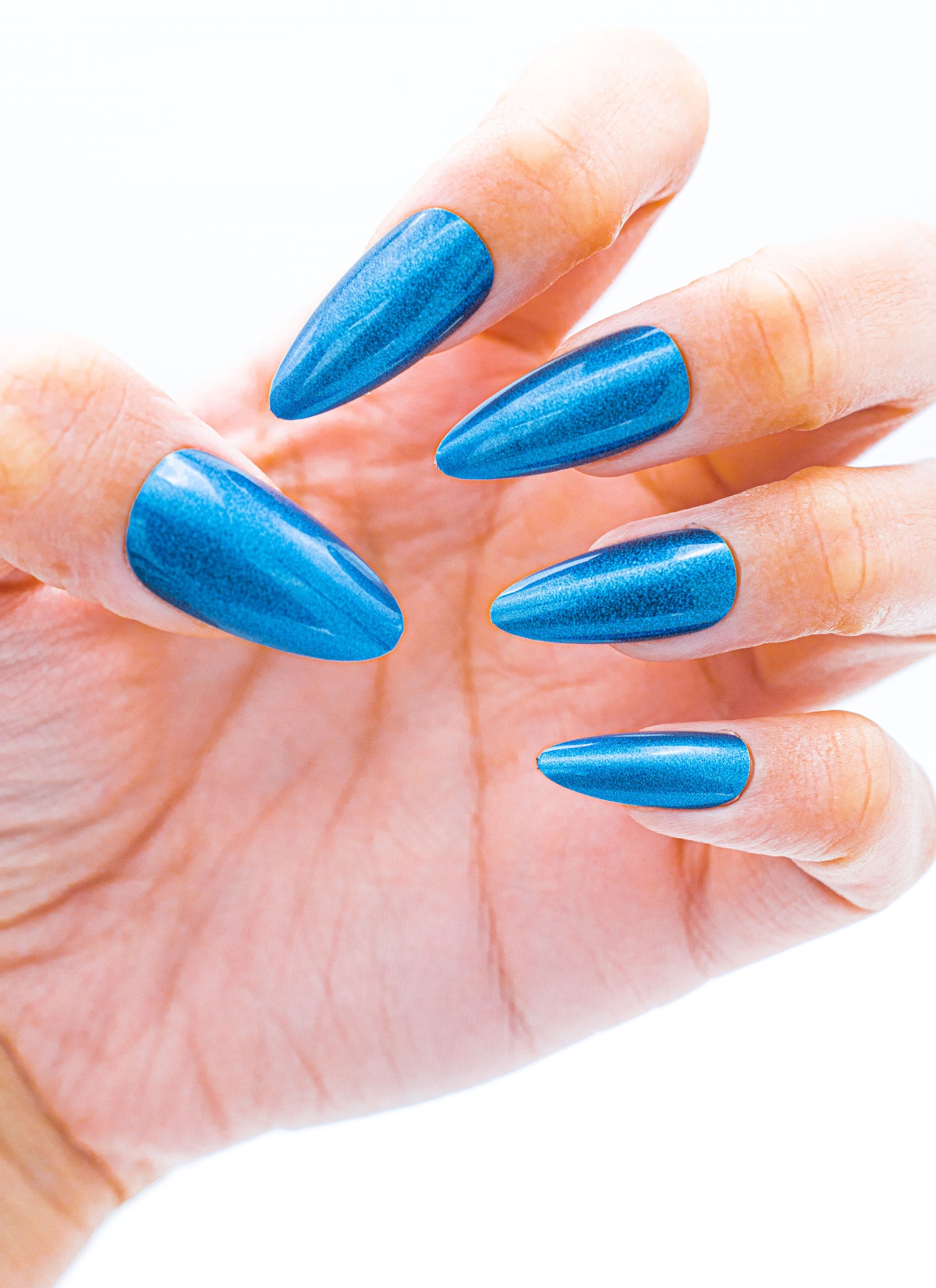Close up image, Sapphire Sparkle: Royal Blue Stiletto Press-On Nails | Shop Now!