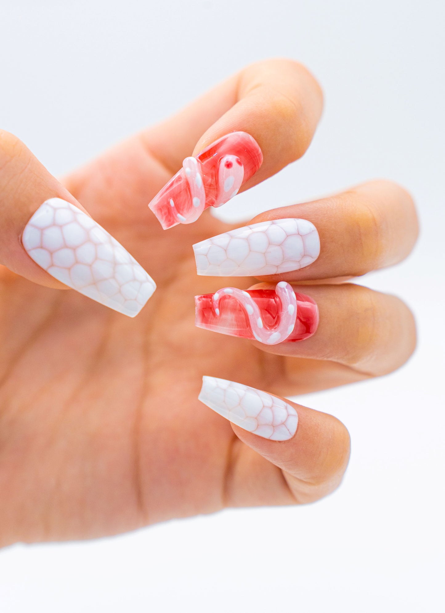 Close up image, Serpentine Charm: White Snake Print and Candy Pink Jelly Medium Coffin Press On Nails