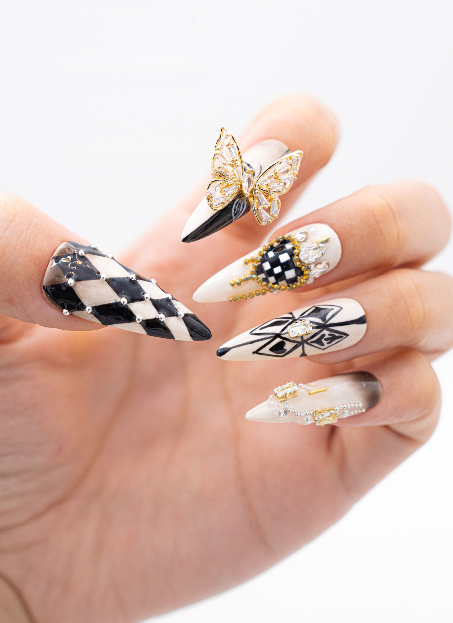 Close up image, Art Deco Press-On Nails with Butterfly Accents & Checkerboard | Glamorous Manicure